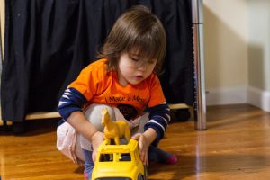 Girl toddler playing at kids at work